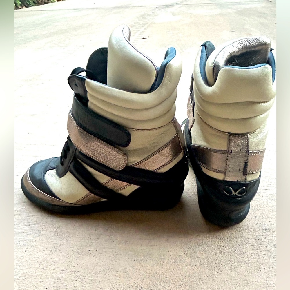 Monika Chiang High Top Cream And Black Strap Wedge Sneakers.